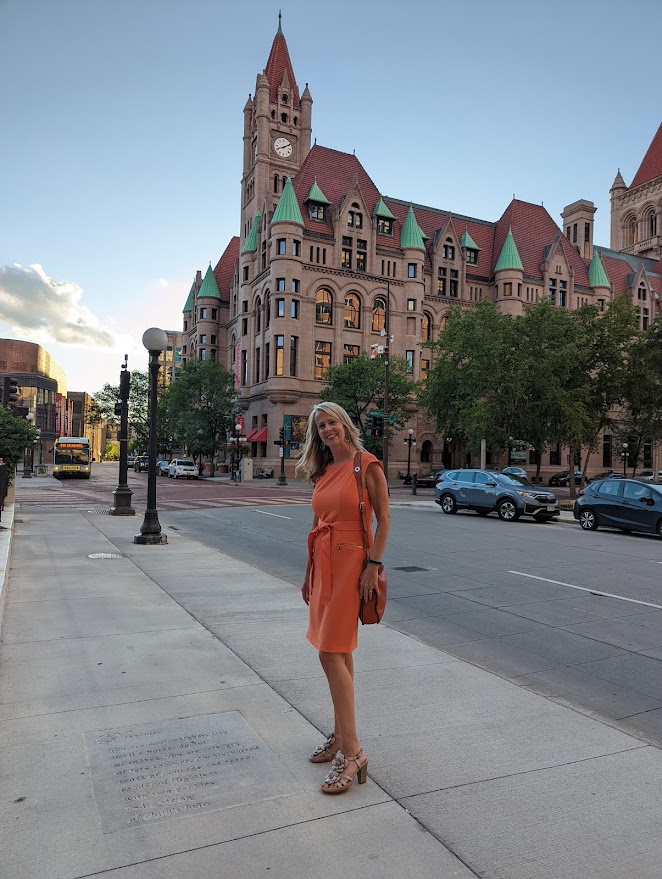 Paige Riehl&rsquo;s poem Dragonfly stamped in a sidewalk near Landmark Center in St. Paul, distant view